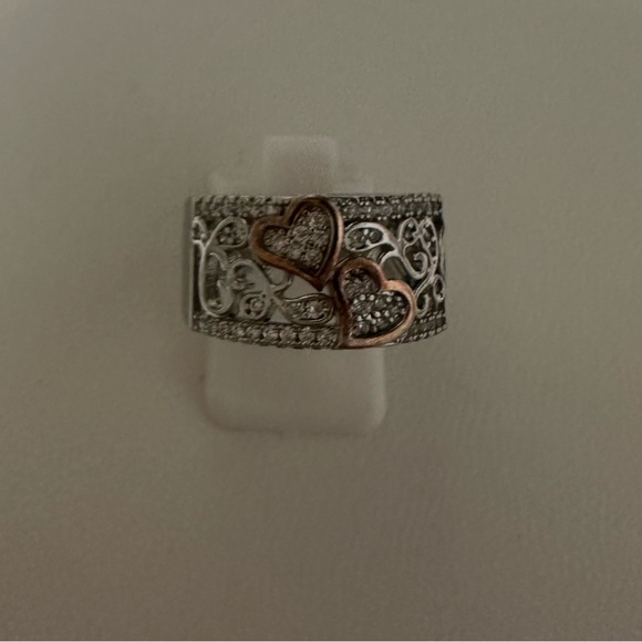 Beautiful engagement steinless steel ring with two cooper color hearts . - Picture 2 of 3